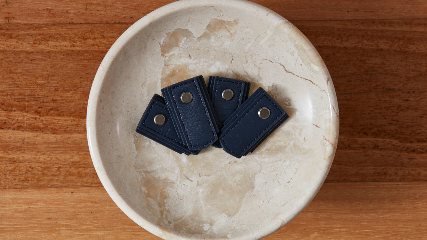 Navy leather pull handle by Sagitine, perfect for cabinets and drawers