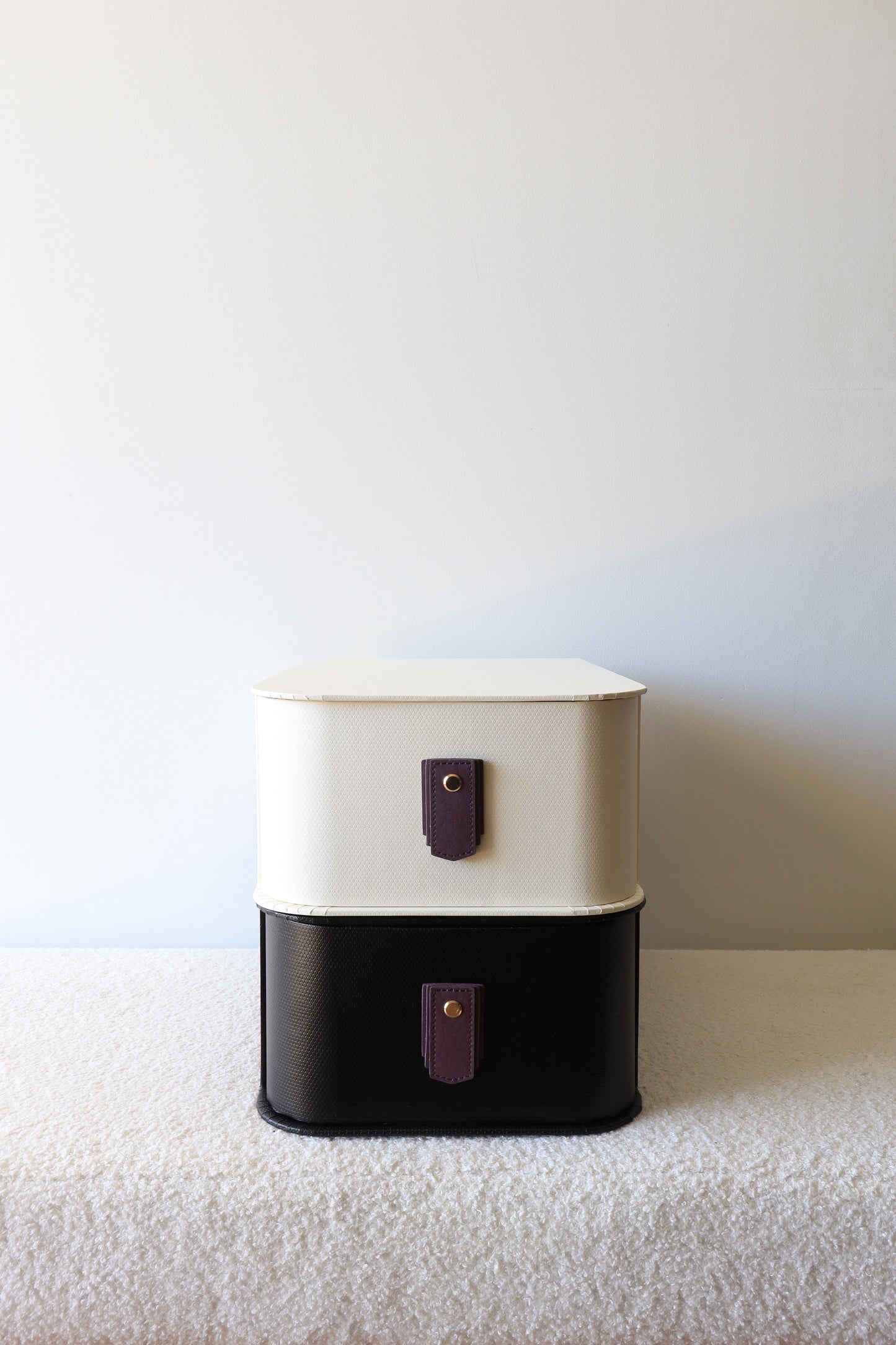 Plum leather pull handle by Sagitine, featuring a sleek and modern design.